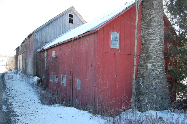 Back of the barn mid-renovation with exterior staircase